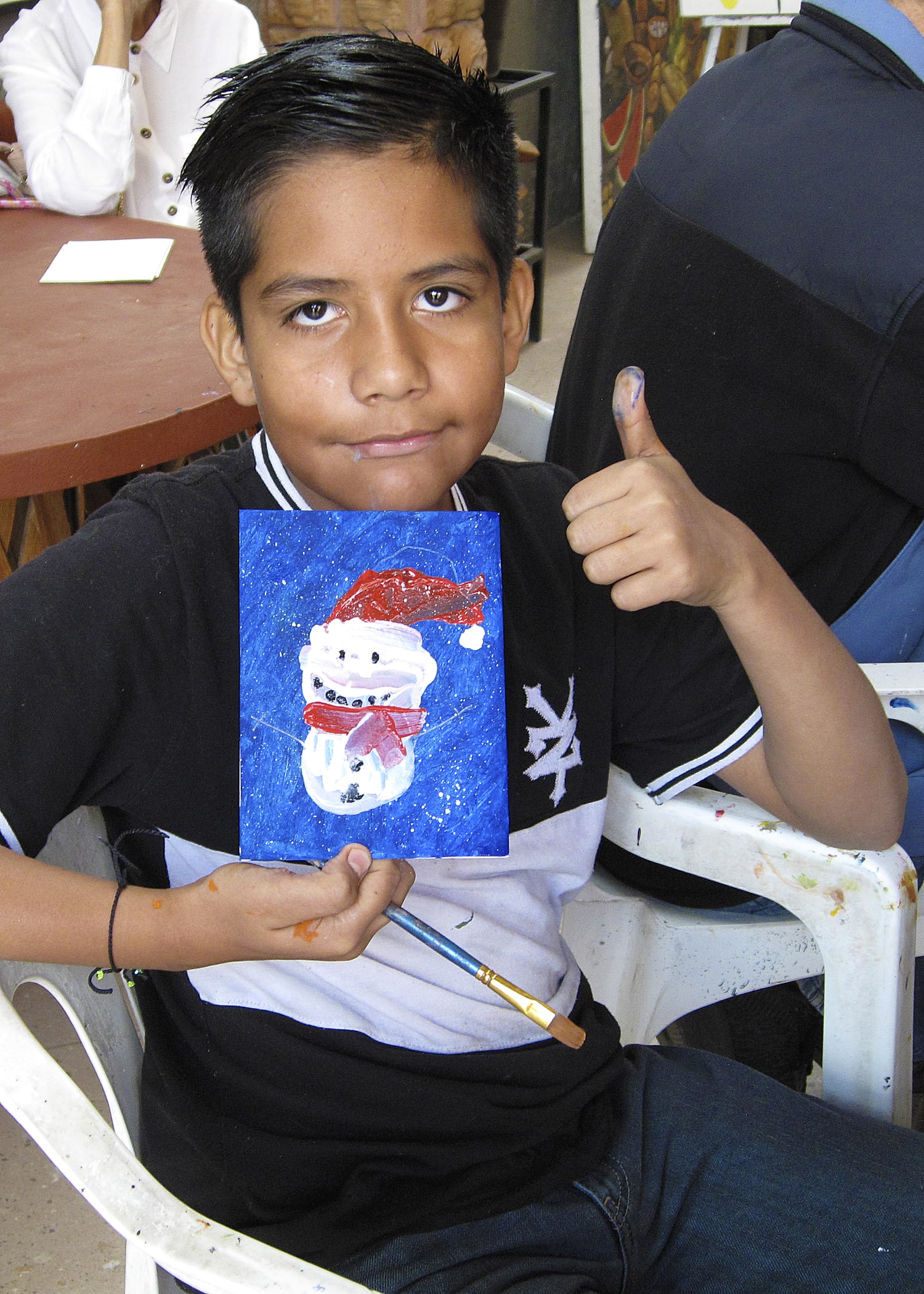 Young artist displaying his work